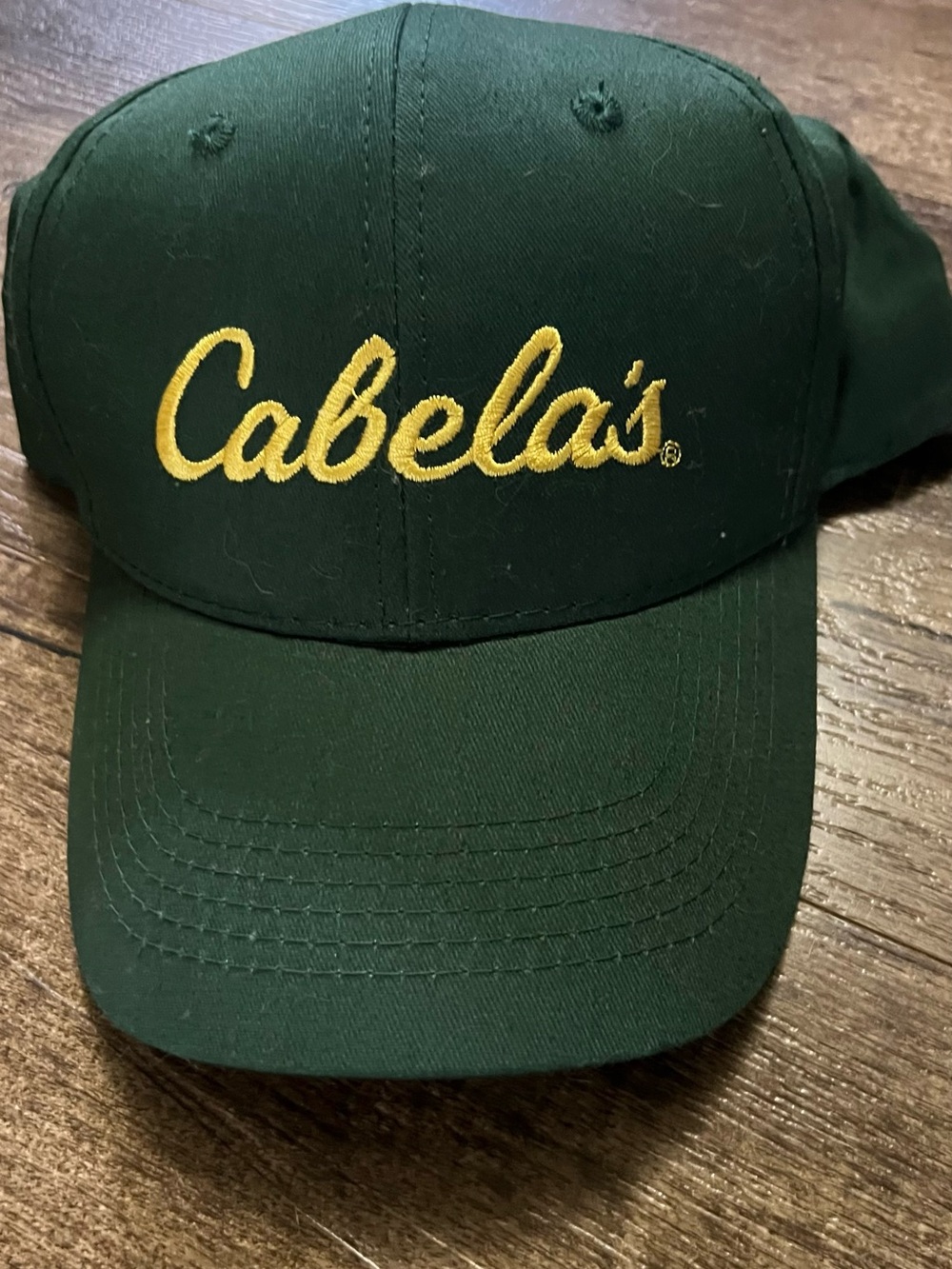 Cabela's men’s Dark Green Baseball Cap with Yellow Logo